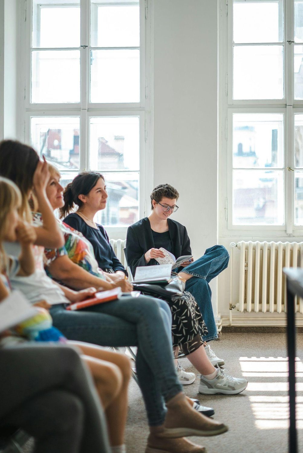 A group seated together in a bright room