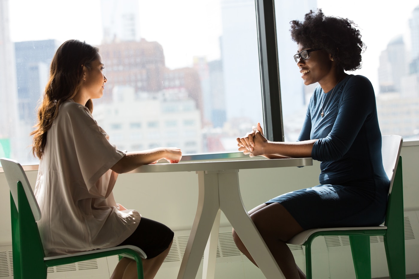 Two people in conversation across a table