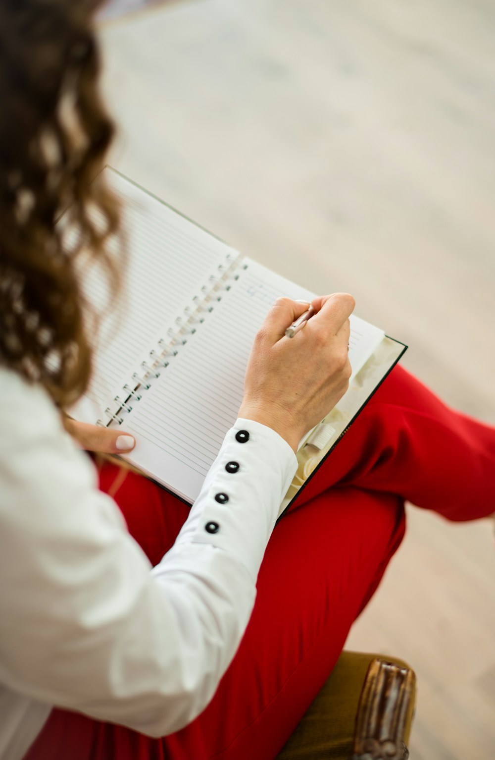 A clinician reviewing notes on paper