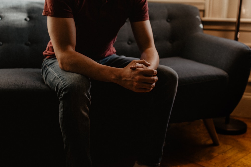 A person sitting quietly on a sofa